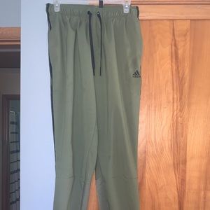 Army green Adidas sweatpants